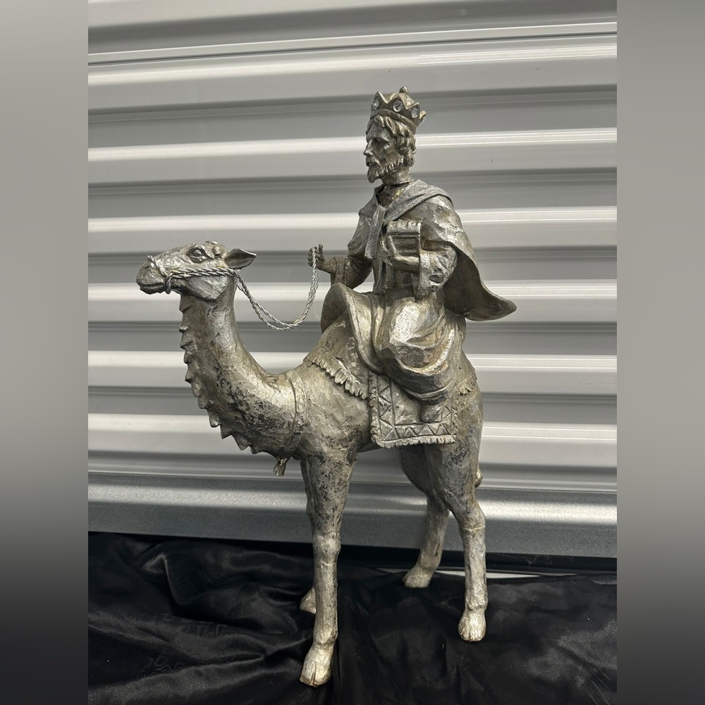 Silver wiseman on camel with decor boxes and tree